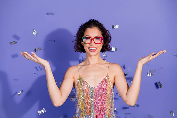 Party glasses with multi-colored pompoms, with copy space