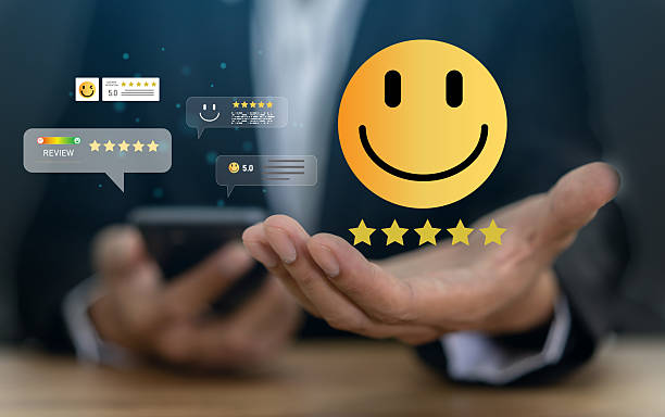 istock Customer satisfaction feedback with five star rating system, hand hold with digital smiley face quality service review, business evaluation, client experience, online review management 2233298842