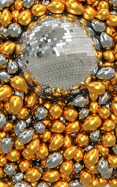 istock Mirror ball surrounded by gold and silver balloons 2233300960
