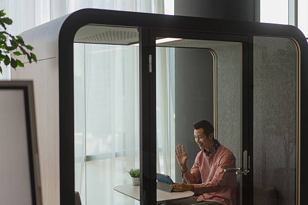 istock Asian male executive working in a privacy pod in office 2233302737
