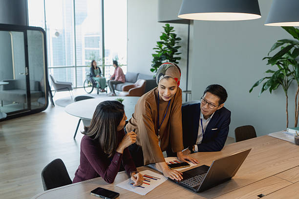 istock Multiracial Asian office executives at a small team discussion 2233304916