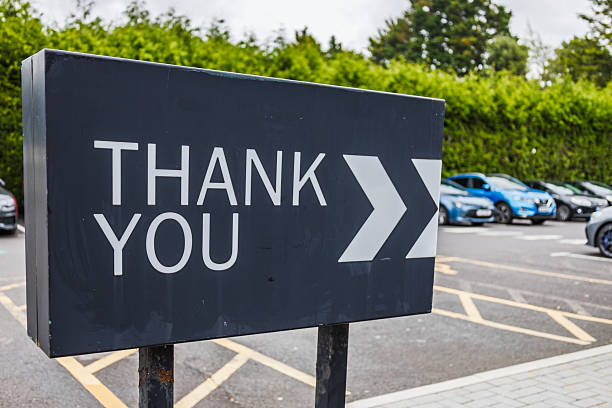 istock Thank You Sign with Directional Arrows at Parking Lot Exit for Clear Wayfinding 2233306075
