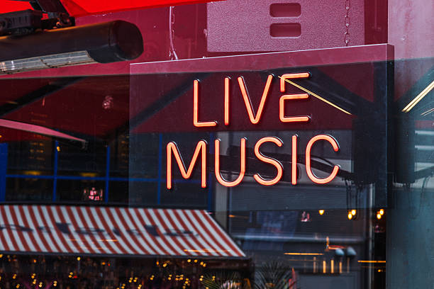 istock Glowing Live Music neon sign in bar window 2233306267