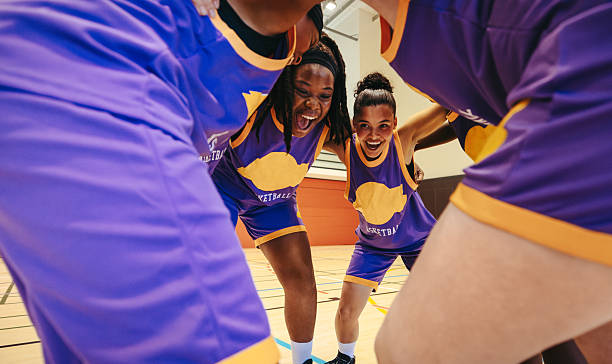 istock Female basketball team in group huddle sharing encouragement and unity 2233308514