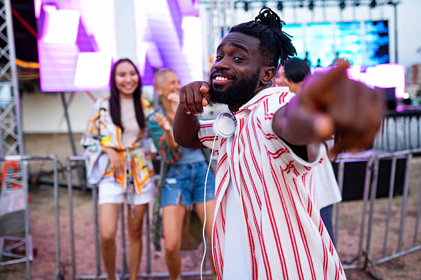 istock Group of friends dancing at a concert 2233310236