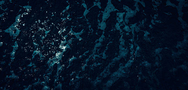 istock dark blue sea water, closeup 2233312282