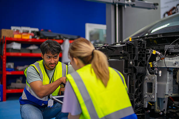 istock Mechanics are working at EV car workshop. 2233312500