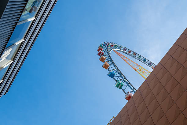 istock Looking up at the Ferris wheel against the blue sky 2233313009
