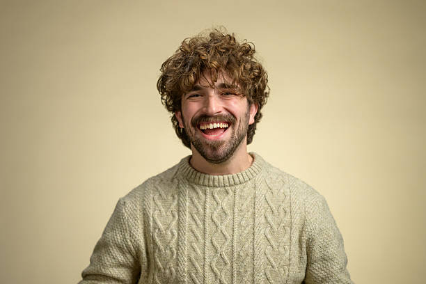 istock Cheerful Young Hispanic Male Wearing Cozy Sweater 2233317342
