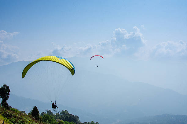 istock Paragliding Adventurers Soaring Above Scenic Mountains 2233320250