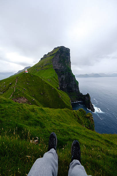 istock Stunning panoramic view of the Faroe Islands with dramatic cliffs and serene waters below 2233321879