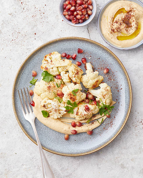 istock Roasted cauliflower with hummus 2233321989