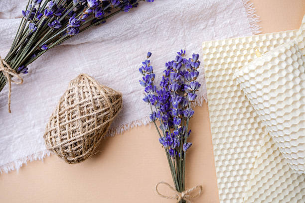 istock Dried lavender bunch with beeswax candle and rustic twine on fabric 2233324382