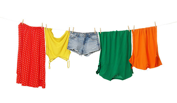 istock Different clothes drying on laundry line against white background 2233326166