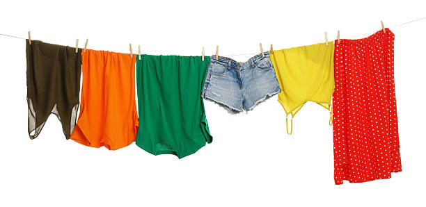 istock Different clothes drying on laundry line against white background 2233326185