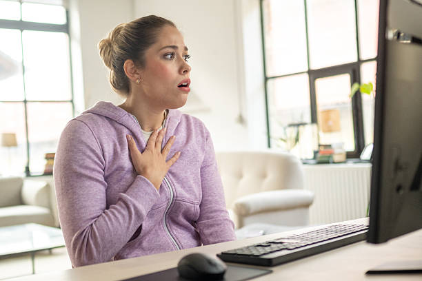 istock Shocked Young Caucasian Female Using Desktop Pc at Home 2233326361