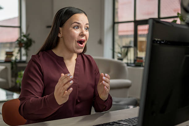 istock Excited Young Caucasian Female Engaging with Desktop Pc at Home 2233326412