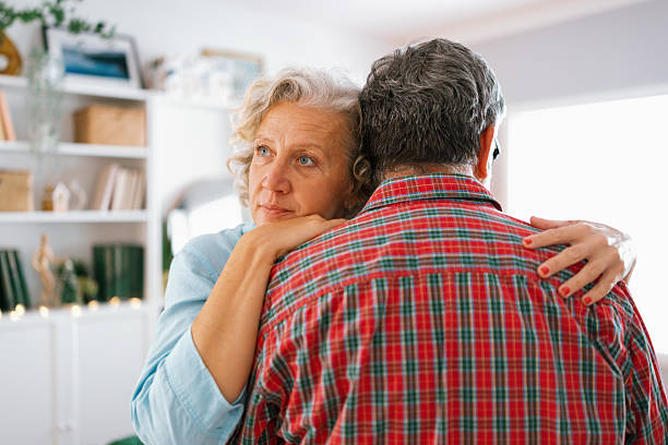istock Unhappy thoughtful woman cuddling husband, feeling stressed 2233326776