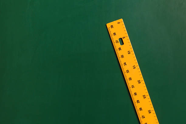 istock One ruler on green chalkboard, top view. Space for text 2233327128