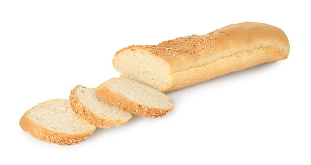 istock Cut fresh baguette with sesame isolated on white 2233327428