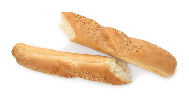 istock Fresh baguette with sesame isolated on white, top view 2233327706