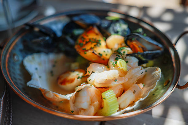 Seafood platter. Grilled lobster, shrimps, scallops, langoustines, octopus, squid on vintage plate.