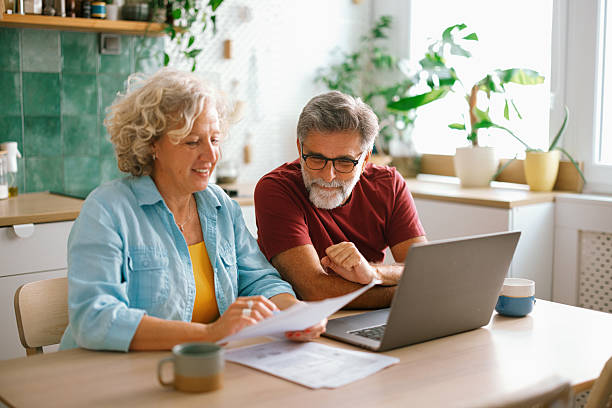 istock Retired couple organizing finances at home 2233330525