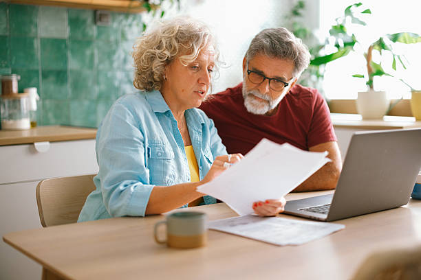 istock Elderly couple struggling with finances at home 2233330649