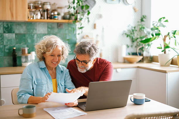 istock Senior couple managing home finances on laptop 2233330672