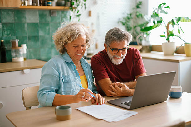 istock Retired couple organizing finances at home 2233330796