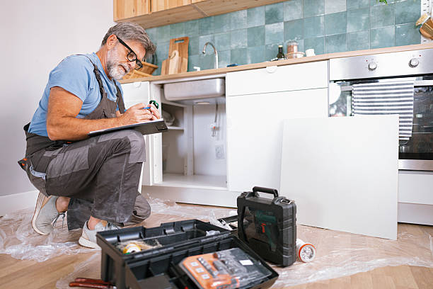 istock Plumber inspecting home with clipboard 2233330895