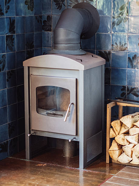 istock Grey fireplace with firewood rack indoors 2233332985