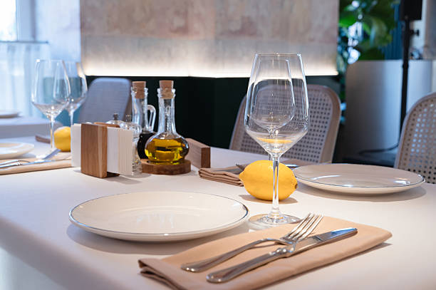 istock An Elegant Dining Table Setting featuring Olive Oil and Lemons for a Stylish Experience 2233333285