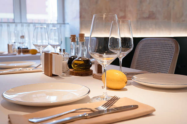 istock An Elegant Restaurant Table Setting featuring Beautiful Glassware and a Slice of Lemon 2233333315