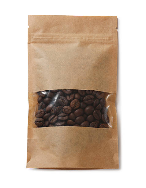 istock Paper pouch bag with coffee beans isolated on white, top view 2233334881