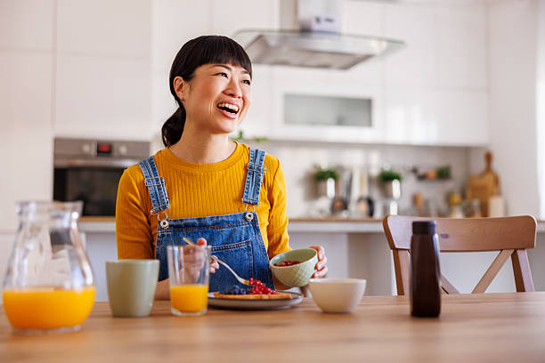 istock Woman having breakfast at home 2233335505