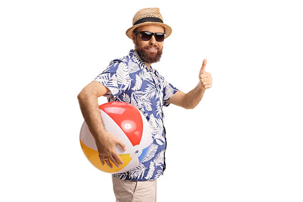 istock Bearded guy with sunglasses holding a beach ball and gesturing thumbs up 2233337426