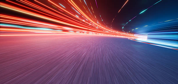 istock 3d rendering racing track with light trails at night showing speed and competition 2233342517