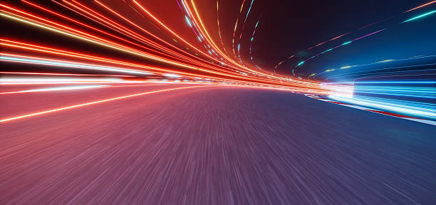 istock 3d rendering fast speed lights trails racing on highway at night 2233342519