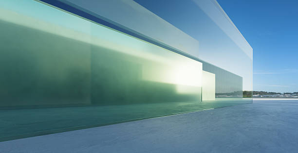 istock 3d rendering modern glass building reflecting sunlight on concrete floor 2233342605
