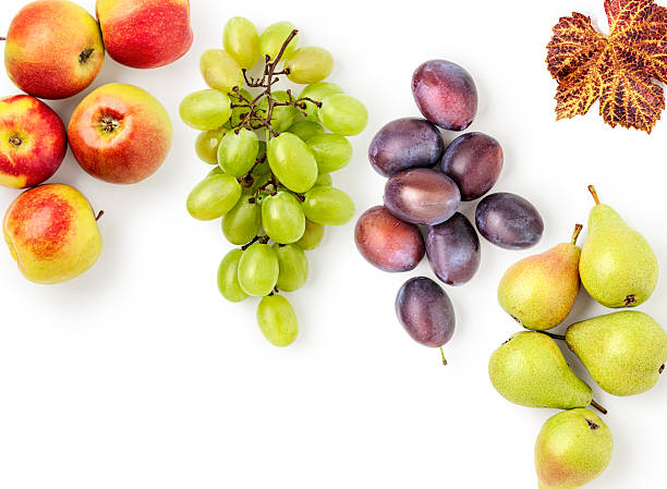 Fresh autumn fruits flat lay frame border photography isolated on white background