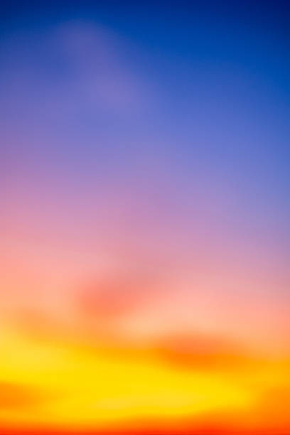 istock Beautiful , luxury soft gradient orange gold clouds and sunlight on the blue sky perfect for the background, take in evening,Twilight, Large size, high definition landscape photo,Vertical 2233350772