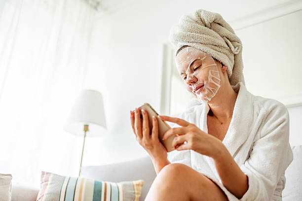 istock Relaxed Woman Enjoying Skincare Routine and Technology at Home 2233351009