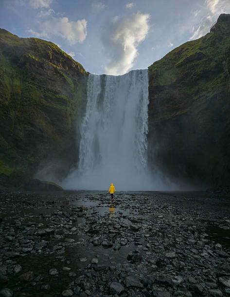 istock Skogafoss waterfall in Iceland, bathed in mist and sunlight on a serene afternoon 2233352574