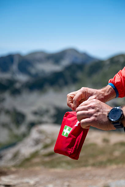 istock Man holding first aid kit in the mountain 2233353902