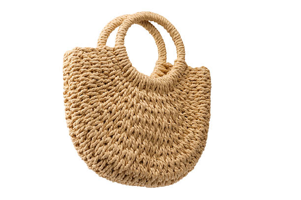 istock A beige straw bag isolated on a white background. 2233360931