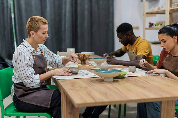 istock Friends enjoying pottery workshop together 2233361589