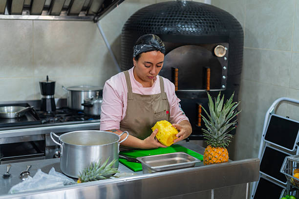 The Latina owner of a restaurant in Bogota, Colombia, prepares to open the doors and begin serving customers.