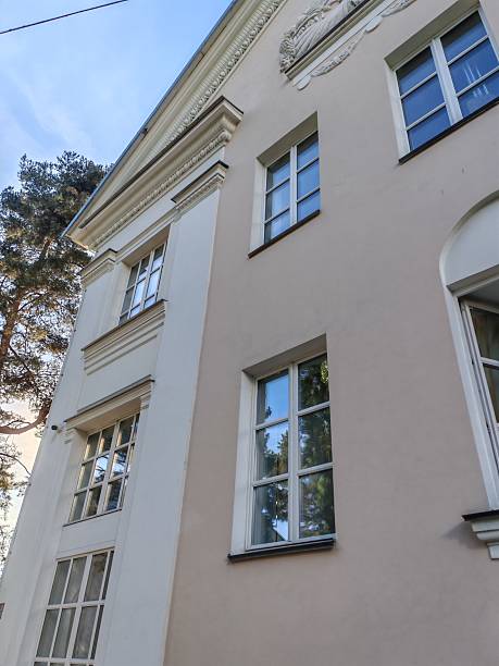 istock A detailed view of a classical building with clean lines, symmetrical windows, and subtle decorative elements. It emphasizes the timeless beauty of heritage design. 2233362600