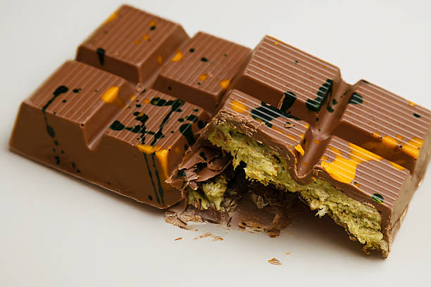 A luxury Dubai chocolate bar featuring rich caramel filling and pistachio topping, perfect for editorial use and product branding.